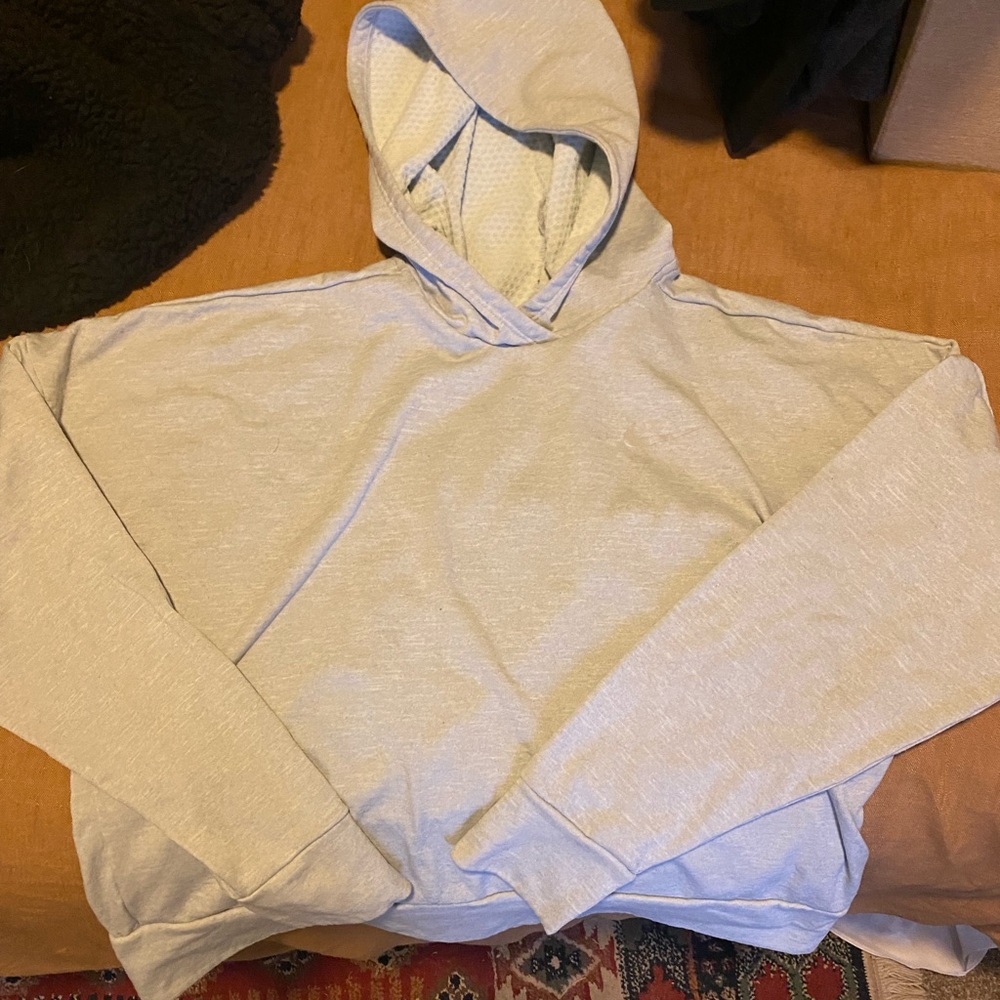 Nike cropped grey running hoodie. Reflective stripe on back, good condition